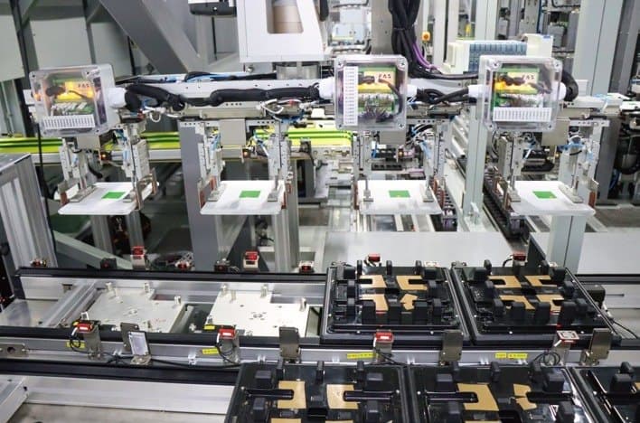 Automated battery module assembly line with test fixtures