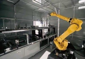 Industrial robot arm in the battery assembly workshop