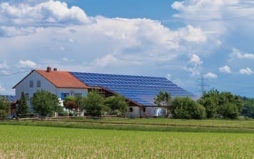 House with rooftop solar in the countryside